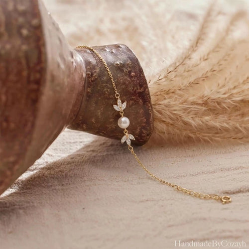 Gold Pearl Leaf Bracelet Delicate shine, soft pearl elegance, and a graceful leaf-inspired finish.