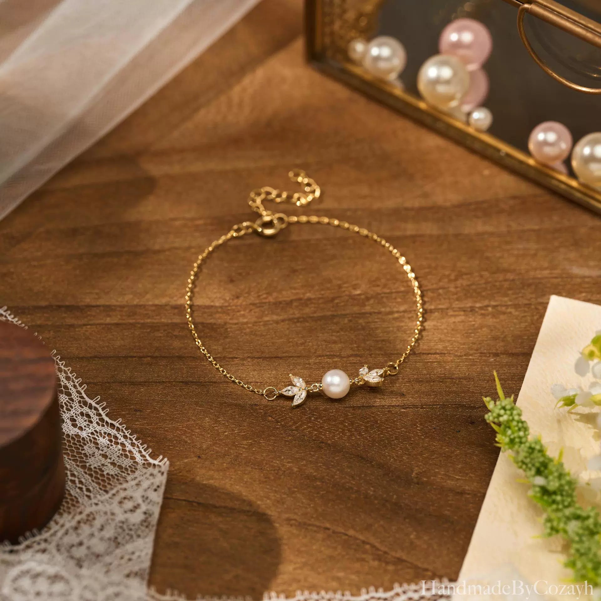 Gold Pearl Leaf Bracelet Delicate shine, soft pearl elegance, and a graceful leaf-inspired finish.