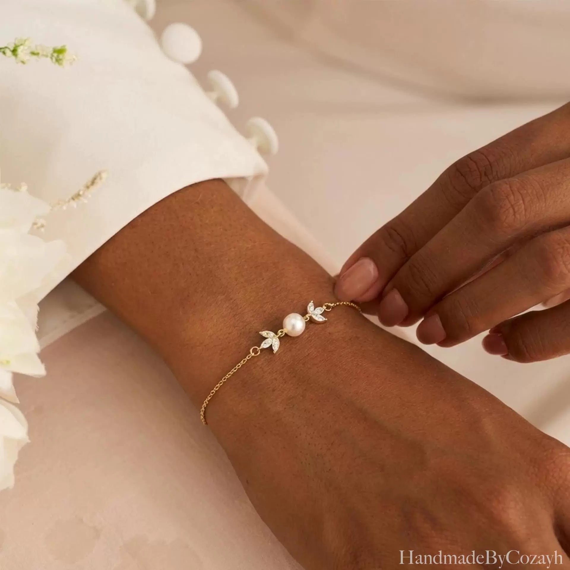 Gold Pearl Leaf Bracelet Delicate shine, soft pearl elegance, and a graceful leaf-inspired finish.