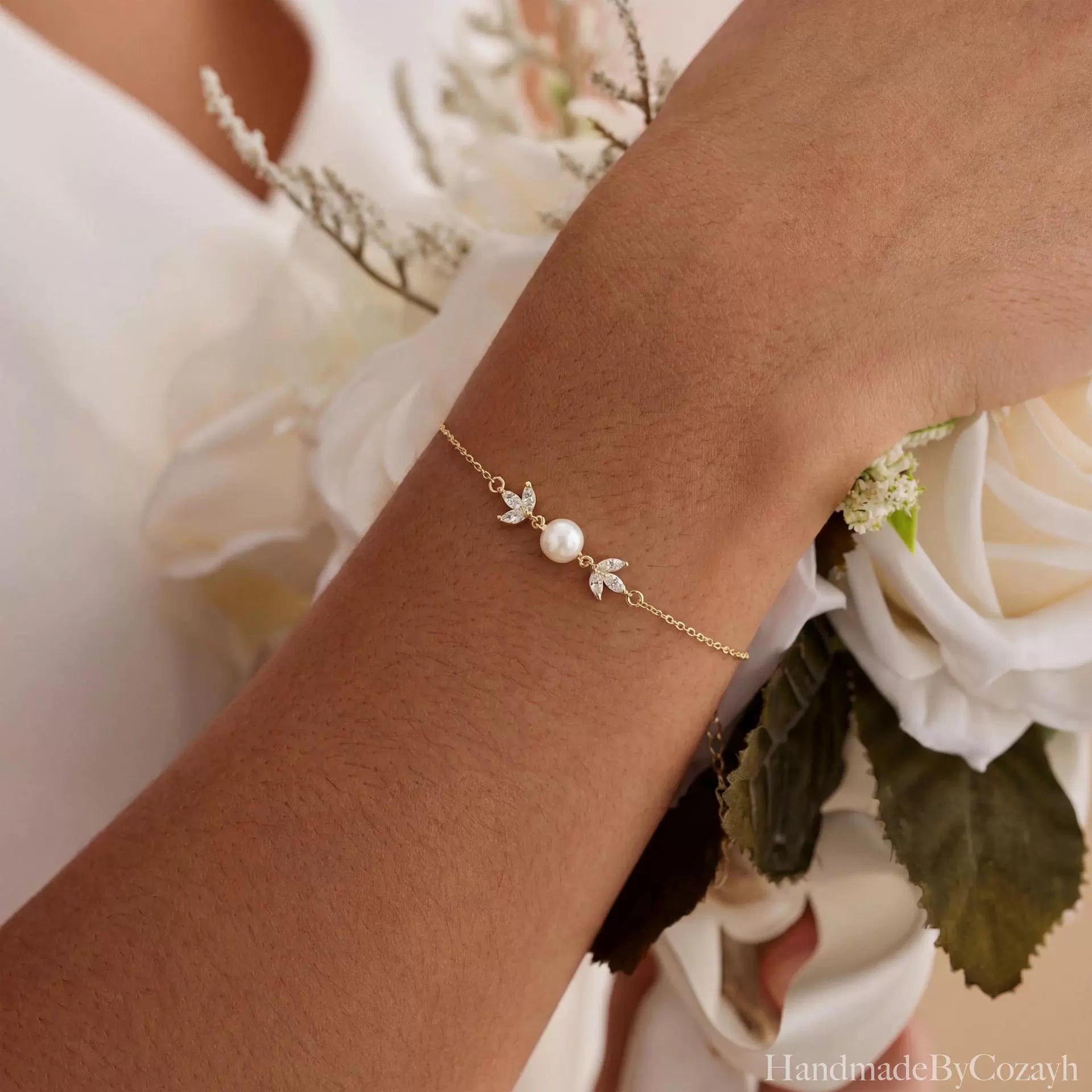 Gold Pearl Leaf Bracelet Delicate shine, soft pearl elegance, and a graceful leaf-inspired finish.